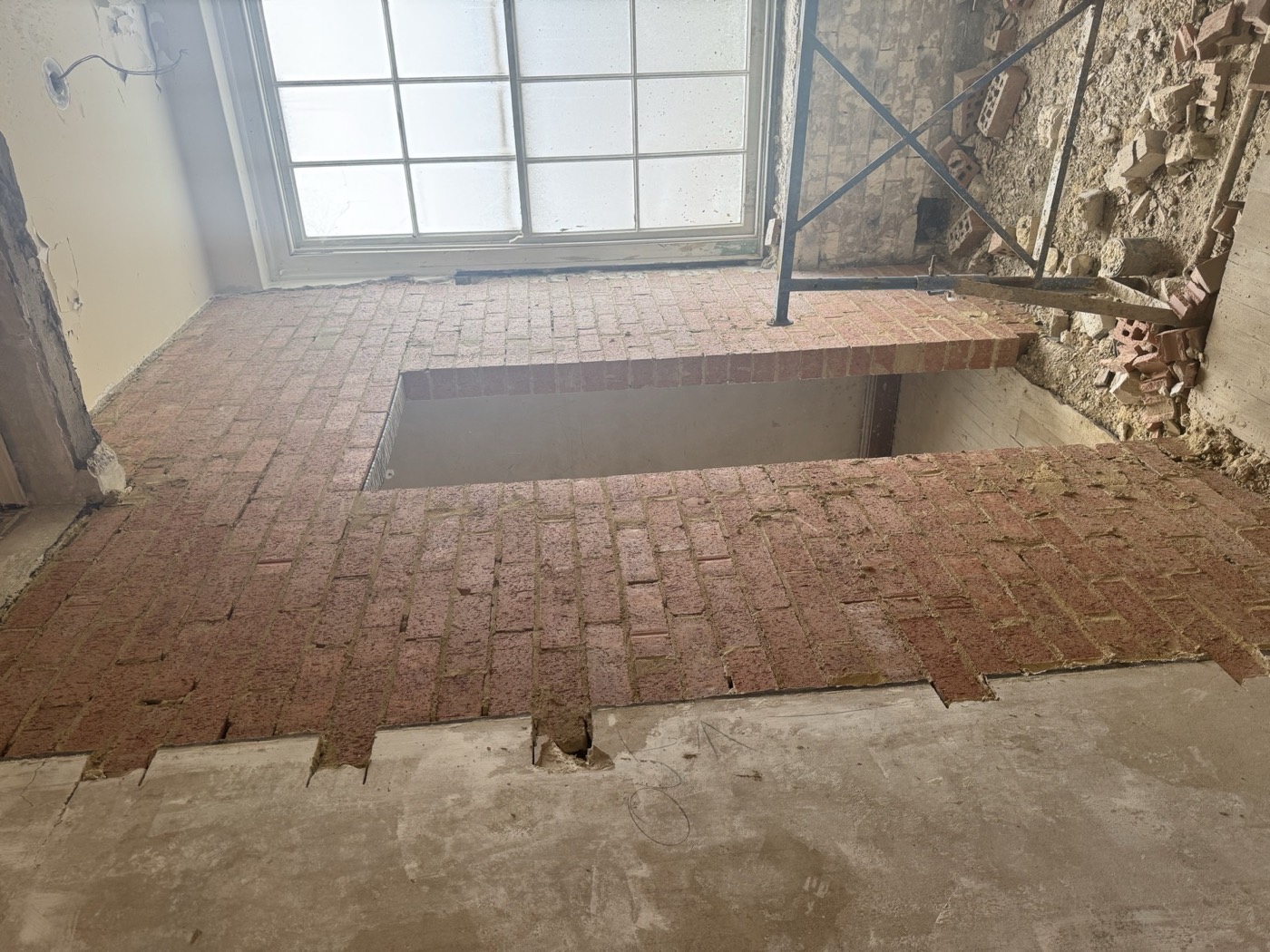 Doorway infilled in matching brick