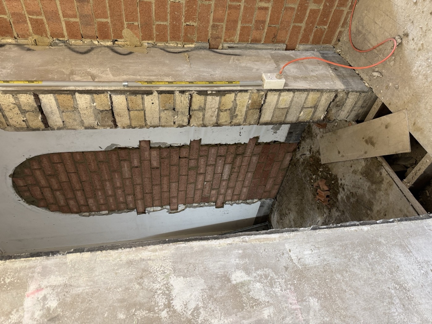 Arched opening rebuilt in matching brickwork