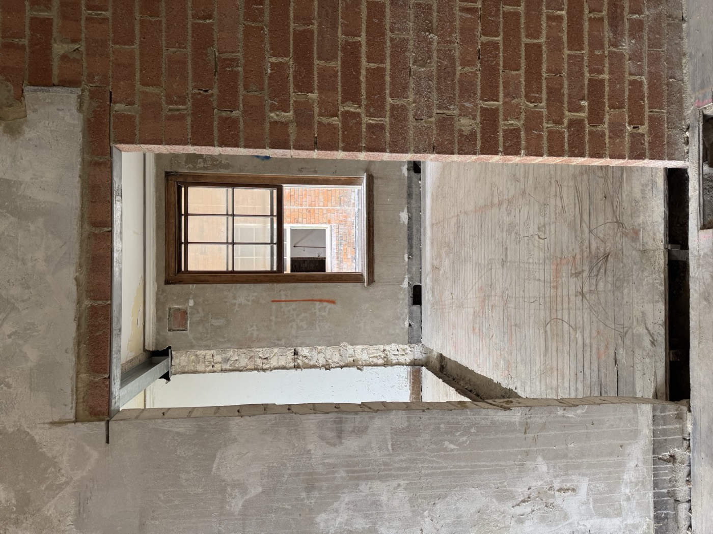 New steel lintel installed over an opening in brickwork
