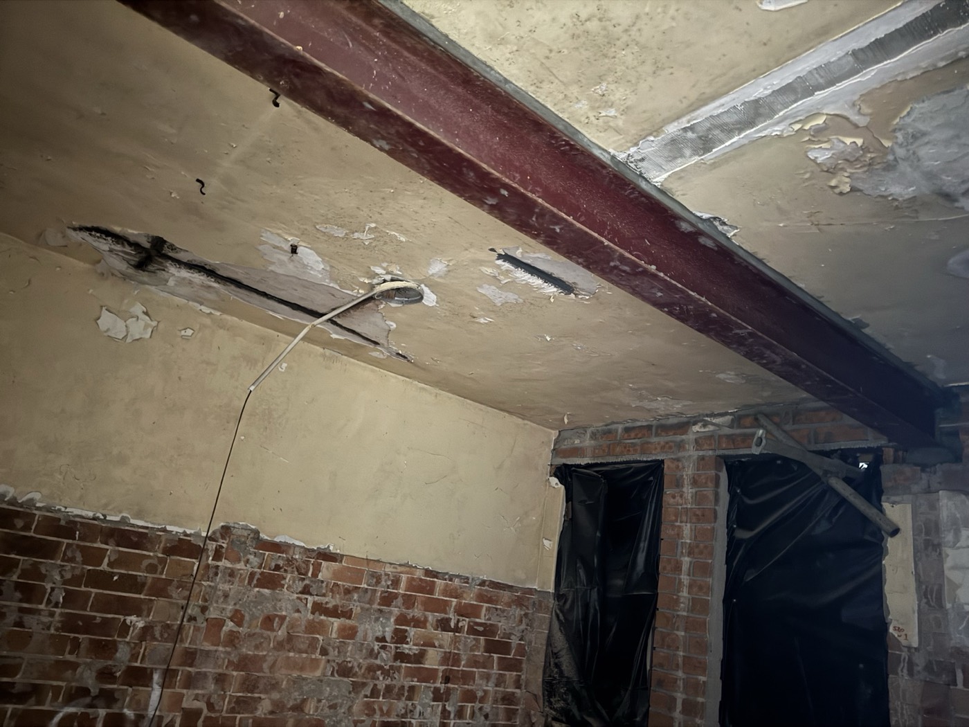 New steel bearing into existing masonry