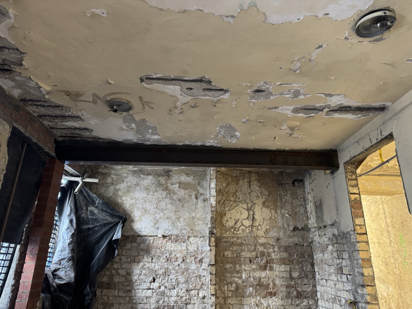 Ceiling opened up to trace the leak