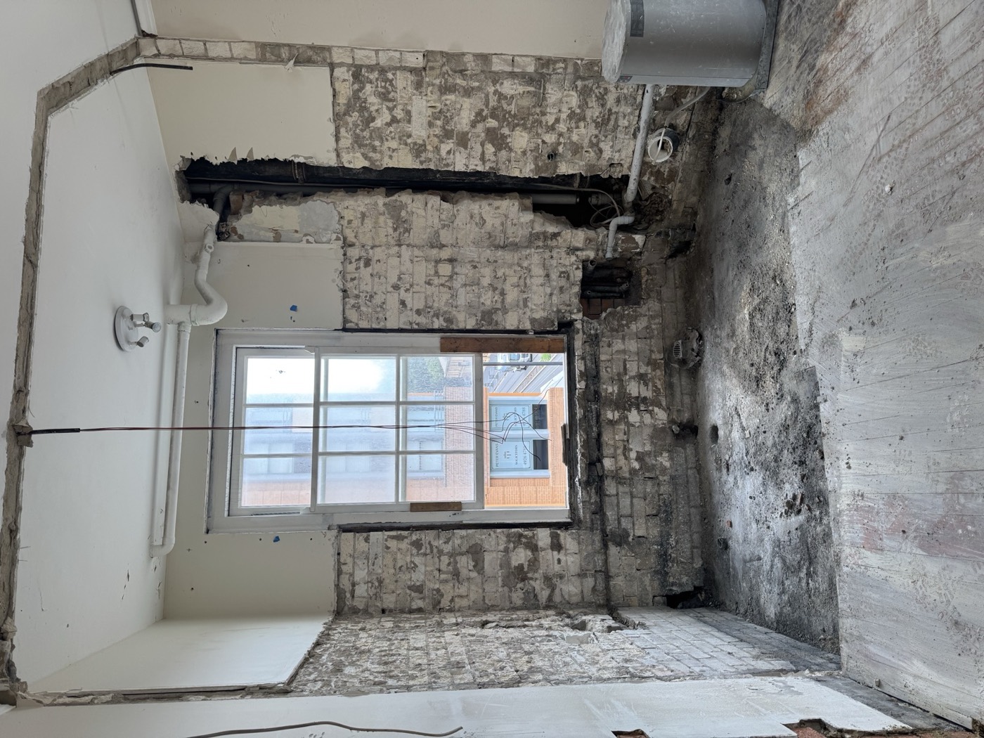 Room stripped back to masonry to remove damaged linings