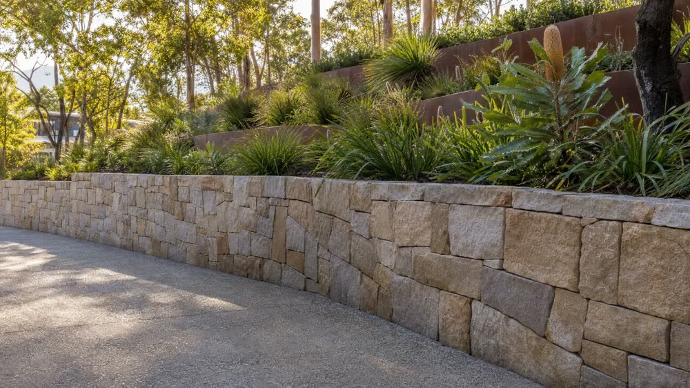 Sandstone wall and garden
