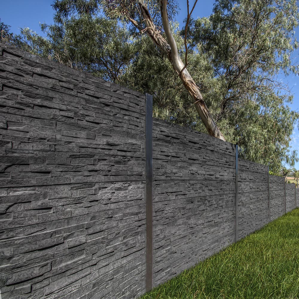 Stone-look concrete sleeper retaining wall with garden